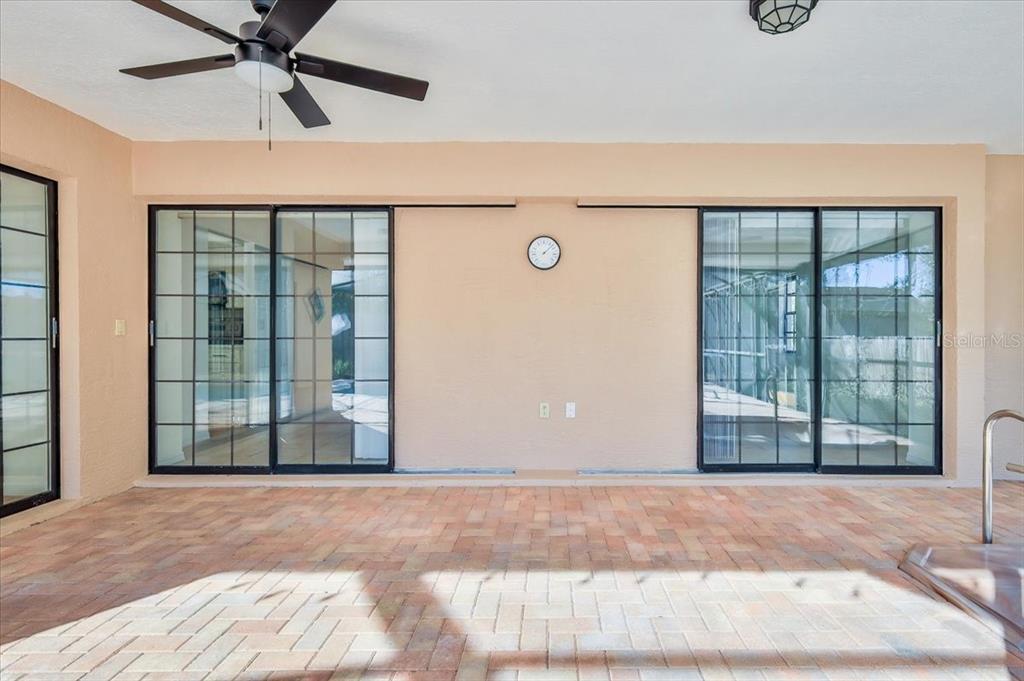 1382 Aladdin Road Spring Hill, FL 34609 - Photo 39 of 45 a view of a livingroom with a ceiling fan and window