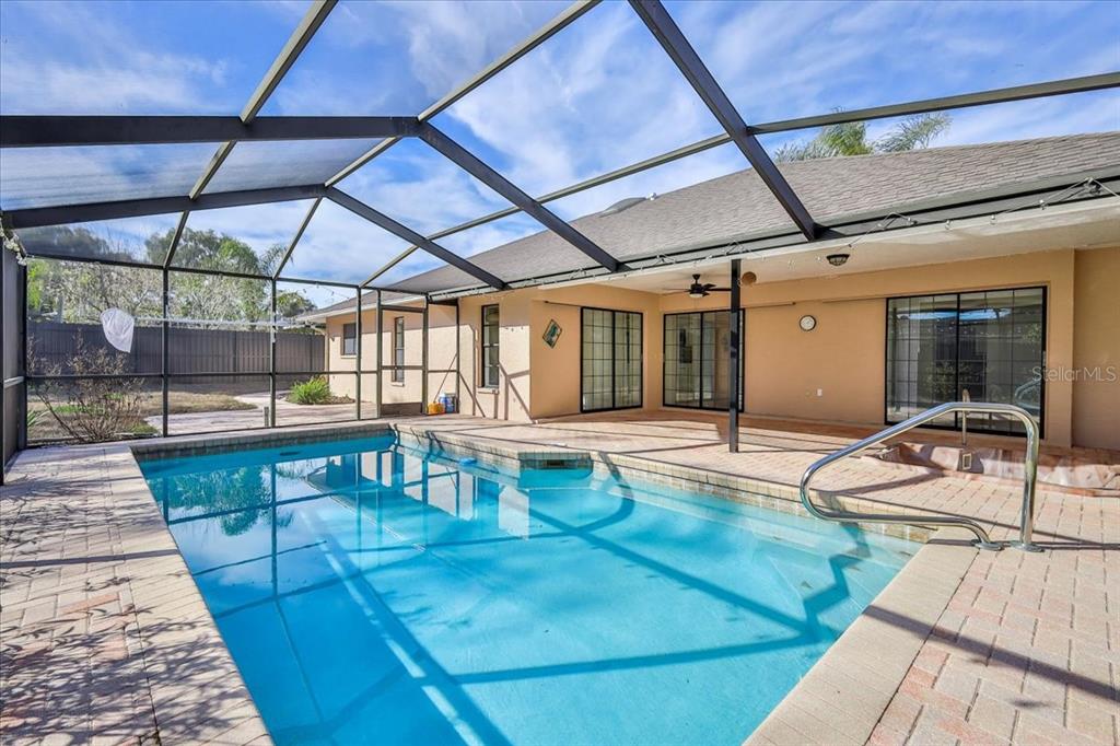 1382 Aladdin Road Spring Hill, FL 34609 - Photo 41 of 45 a view of a swimming pool with a patio