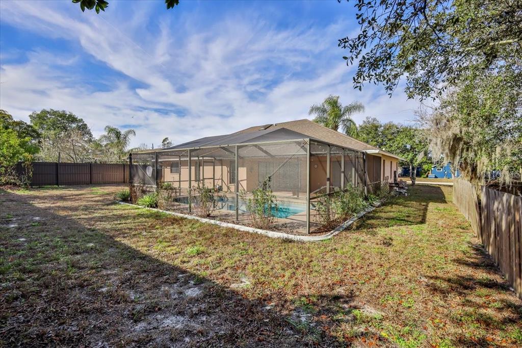 1382 Aladdin Road Spring Hill, FL 34609 - Photo 43 of 45 a view of a house with backyard and a tree