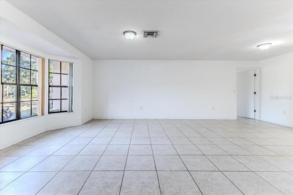 1382 Aladdin Road Spring Hill, FL 34609 - Photo 8 of 45 a view of an empty room and window