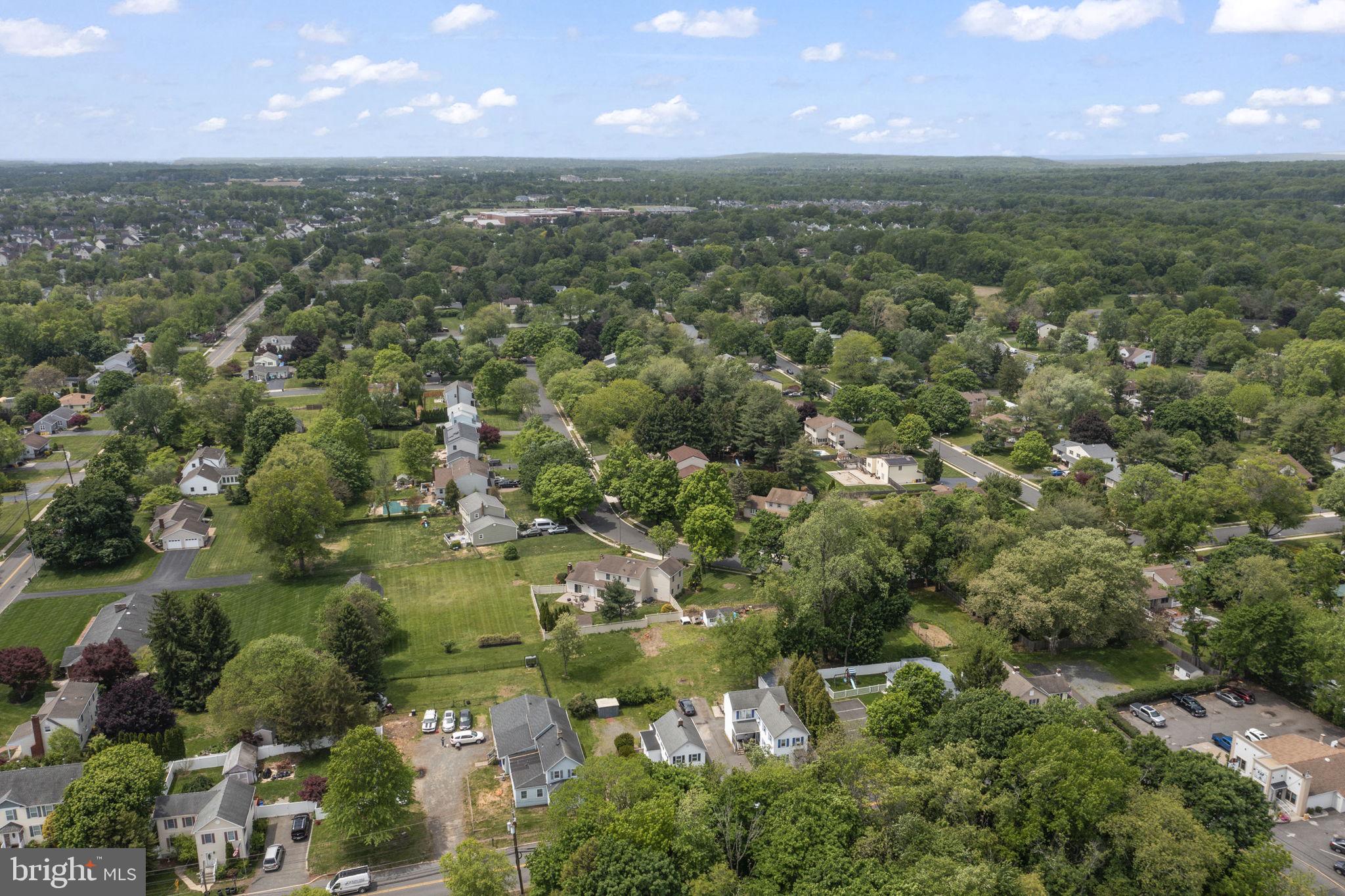 646 Ridge Road Monmouth Junction, NJ 08852 - Photo 34 of 47 Lush suburban landscape under blue skies.