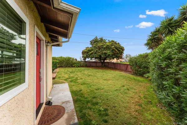 a backyard of a house with lots of green space