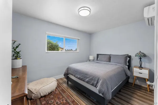 a bedroom with a bed and a table in it