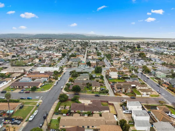 an aerial view of residential houses with outdoor space