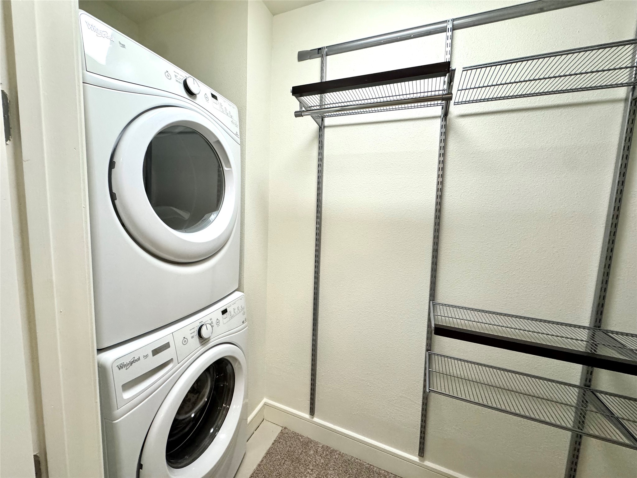 2303 Mid Lane, Unit 710 Houston, TX 77027 - Photo 15 of 19 a utility room with dryer and washer
