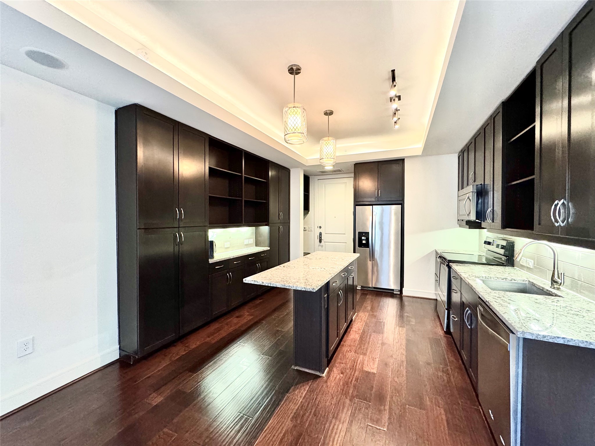 2303 Mid Lane, Unit 710 Houston, TX 77027 - Photo 17 of 19 a large bathroom with a sink a large mirror and shower