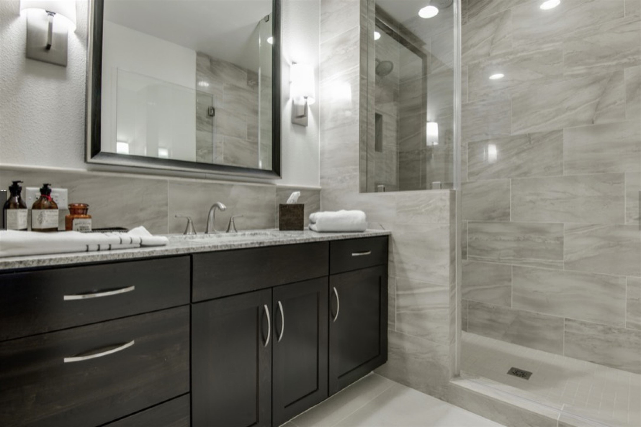 2303 Mid Lane, Unit 710 Houston, TX 77027 - Photo 8 of 19 a bathroom with a sink and a mirror