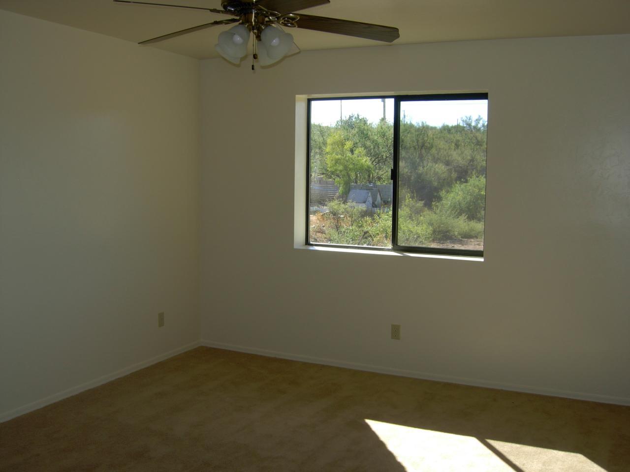 175 Tim Court Rio Rico, AZ 85648 - Photo 5 of 5 an empty room with a window