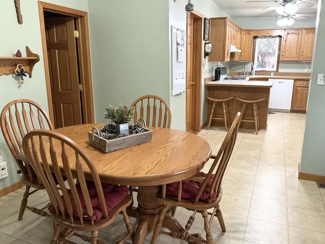 a view of a dining room with furniture and window
