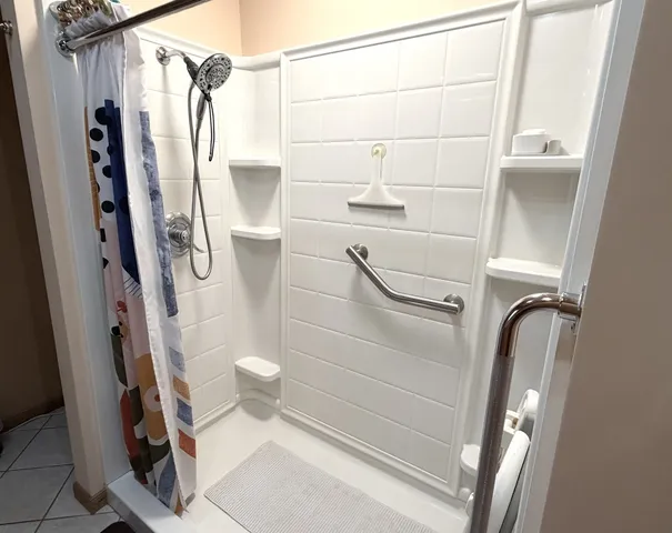 a bathroom with a shower and toilet