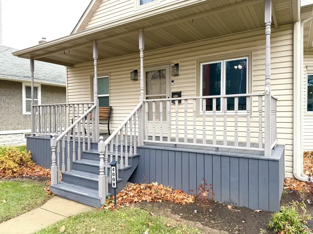 a view of a house with wooden fence