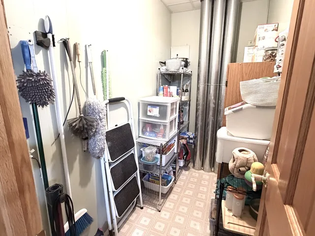 a view of a dining room with furniture and floor to ceiling window
