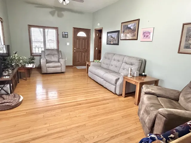 a living room with furniture or couch and a wooden floor