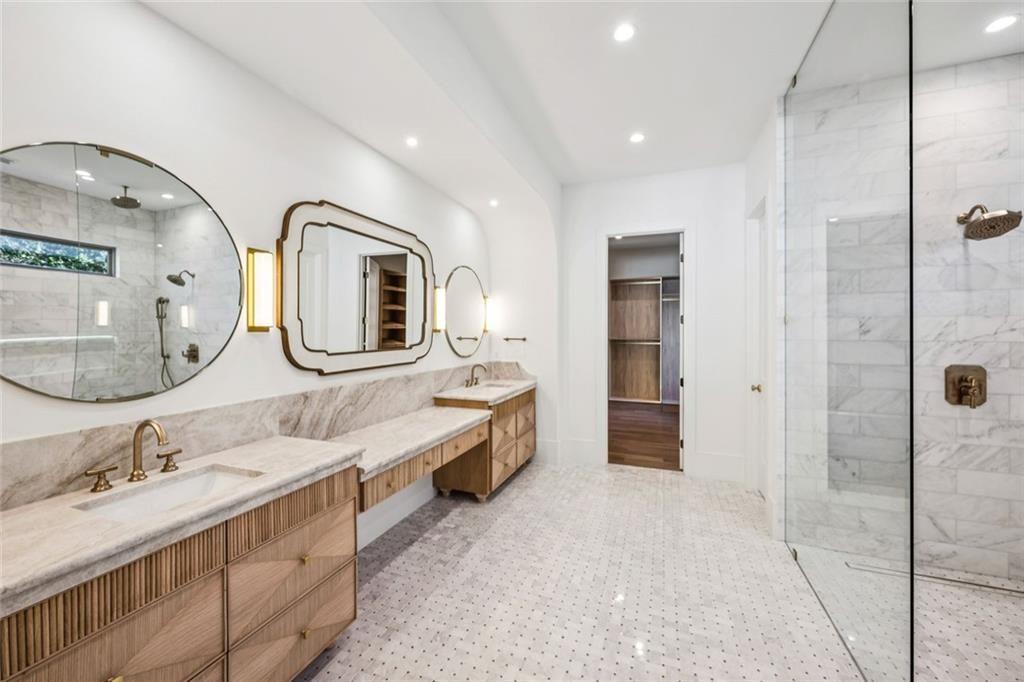 2854 North Thompson Road Northeast Brookhaven, GA 30319 - Photo 17 of 34 a spacious bathroom with a double vanity sink and a mirror