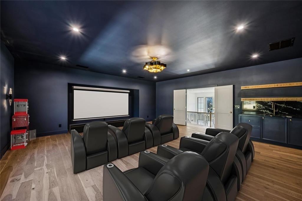 2854 North Thompson Road Northeast Brookhaven, GA 30319 - Photo 28 of 34 a media room with lots of chairs and a projector screen