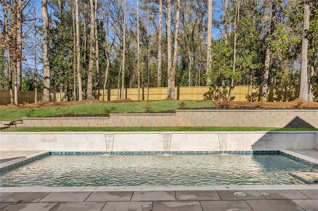 2854 North Thompson Road Northeast Brookhaven, GA 30319 - Photo 30 of 34 a view of a yard with trees