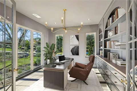 a living room with furniture and a floor to ceiling window
