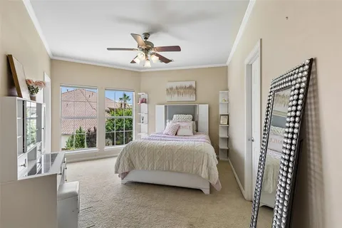 a bedroom with a large bed and a window