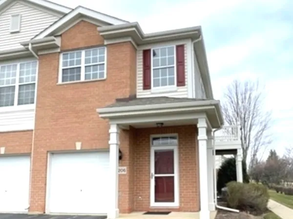 a view of a brick house with a large windows