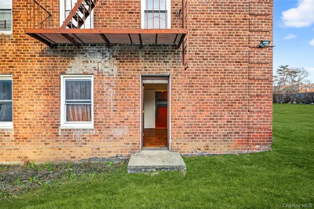 a front view of a building with garden