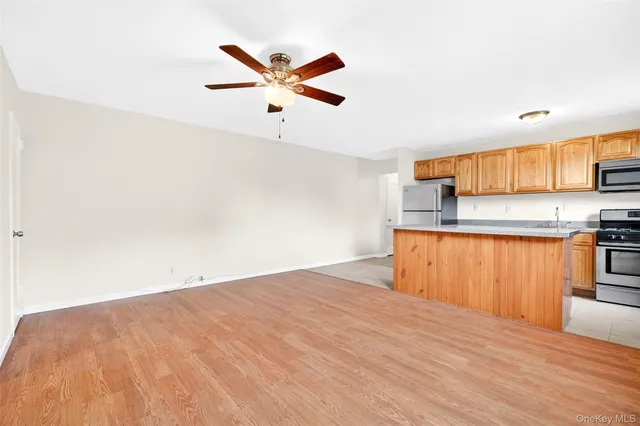 a view of room with wooden floor