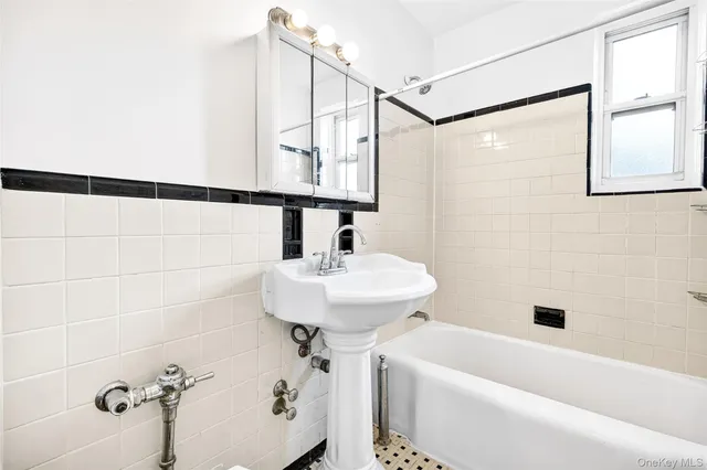 a bathroom with a sink and shower