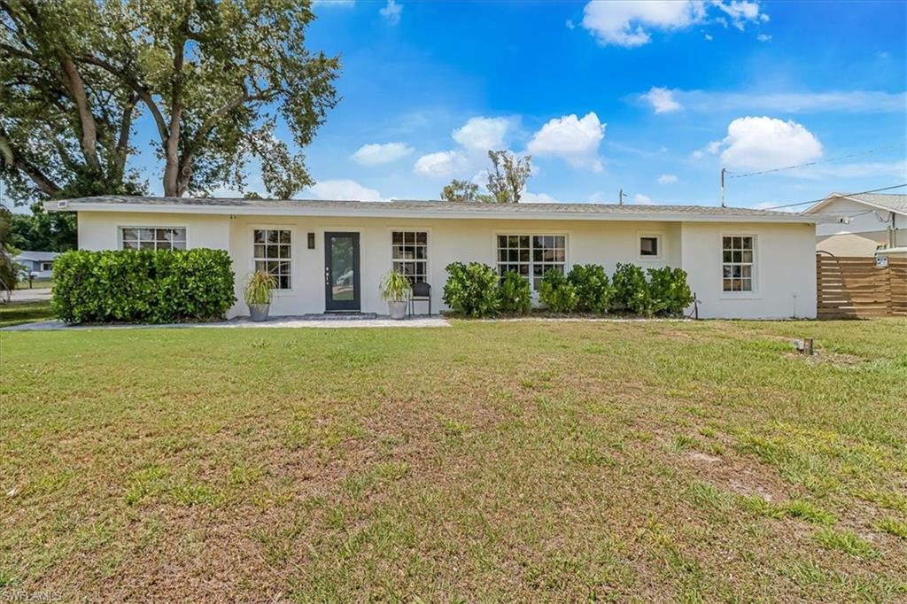 18601 Geranium Road Fort Myers, FL 33967 - Photo 1 of 34 a front view of house with yard and green space