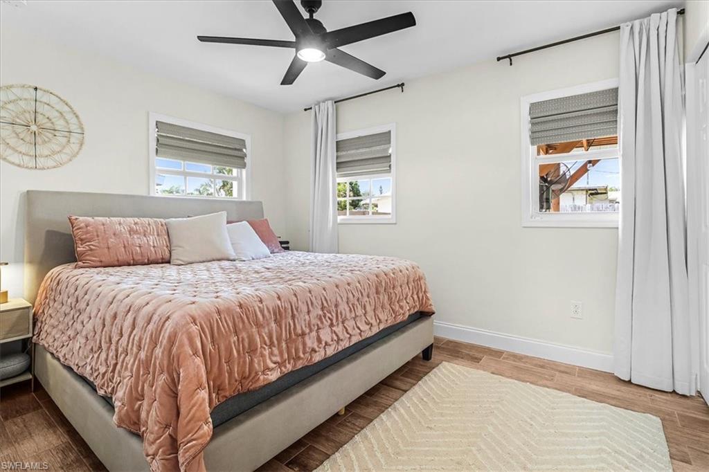 18601 Geranium Road Fort Myers, FL 33967 - Photo 11 of 34 a bedroom with a bed and painting on the wall