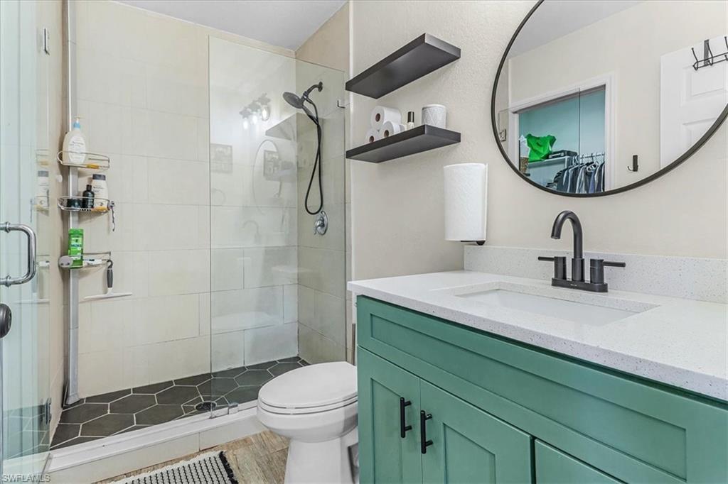 18601 Geranium Road Fort Myers, FL 33967 - Photo 12 of 34 a bathroom with a sink a toilet and shower