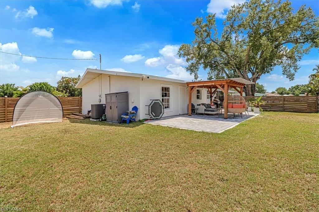 18601 Geranium Road Fort Myers, FL 33967 - Photo 22 of 34 a view of a patio with swimming pool
