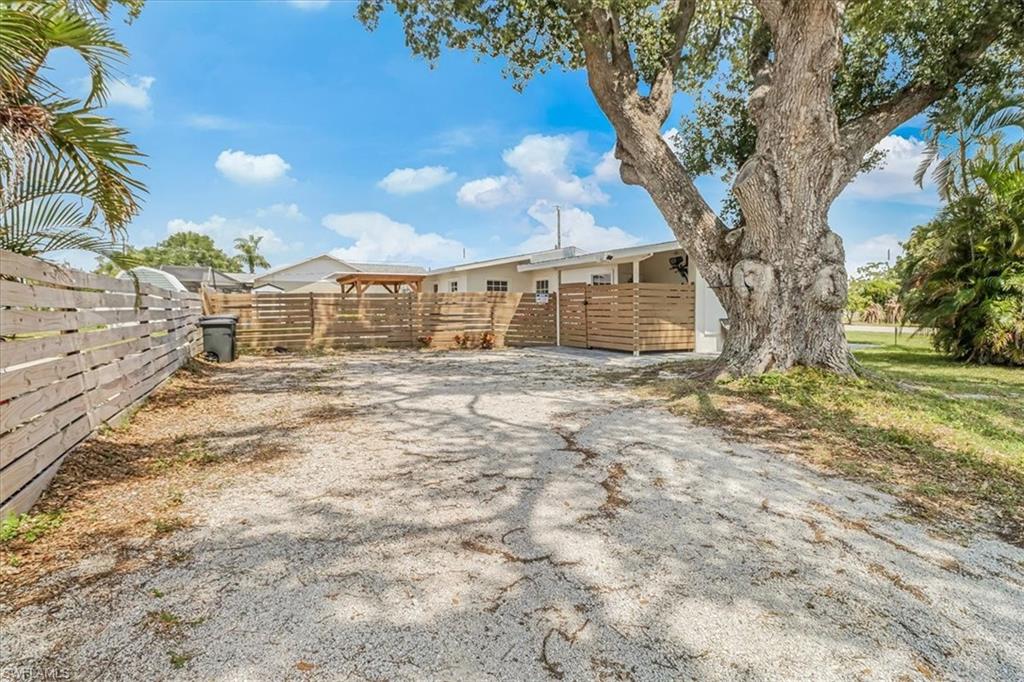 18601 Geranium Road Fort Myers, FL 33967 - Photo 25 of 34 a view of a house with a yard