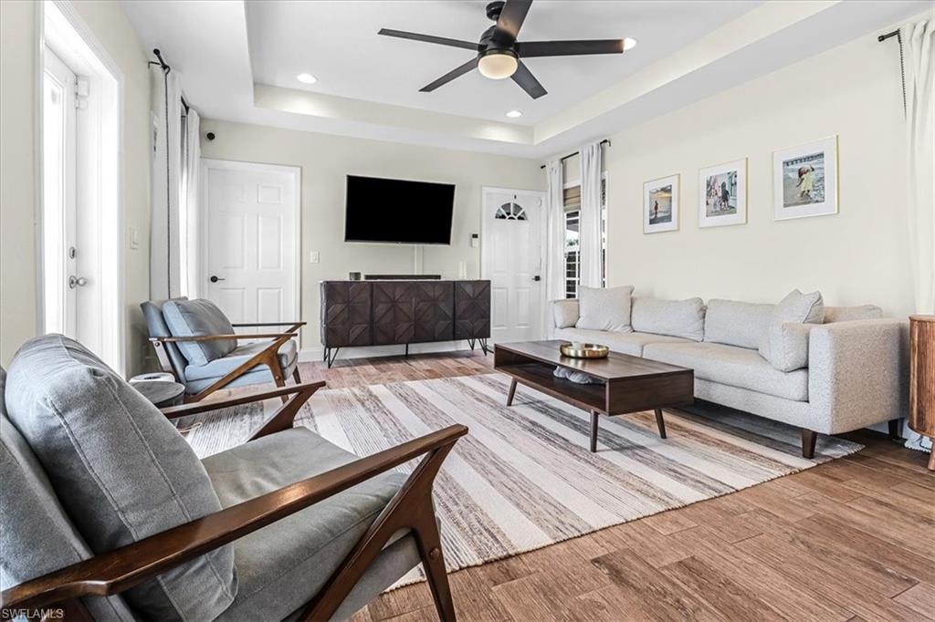 18601 Geranium Road Fort Myers, FL 33967 - Photo 8 of 34 a living room with furniture and a flat screen tv