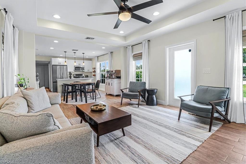 18601 Geranium Road Fort Myers, FL 33967 - Photo 10 of 34 a living room with furniture and a wooden floor
