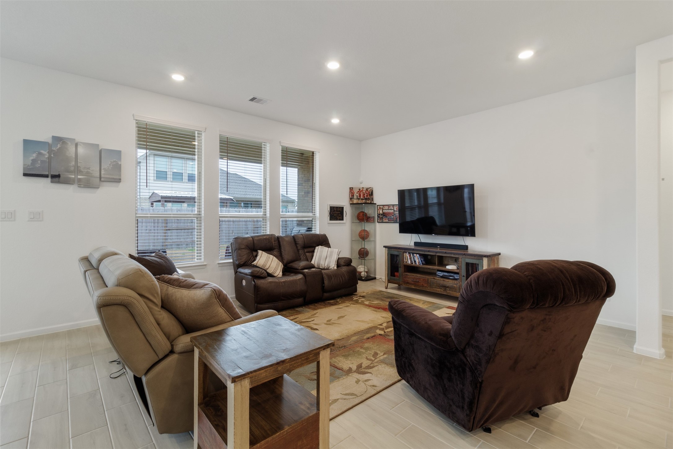3623 Rock Ledge Drive Rosenberg, TX 77469 - Photo 22 of 31 a living room with furniture and a flat screen tv