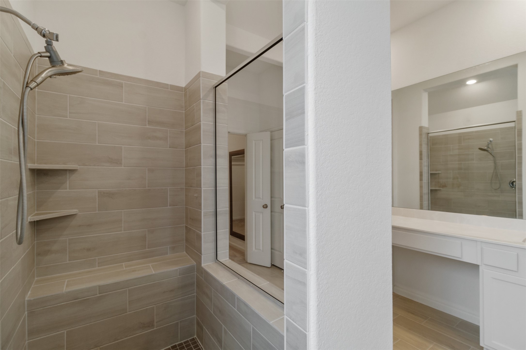 3623 Rock Ledge Drive Rosenberg, TX 77469 - Photo 27 of 31 This cozy walk-in shower is equipped with a bench so you can relax before starting your day.