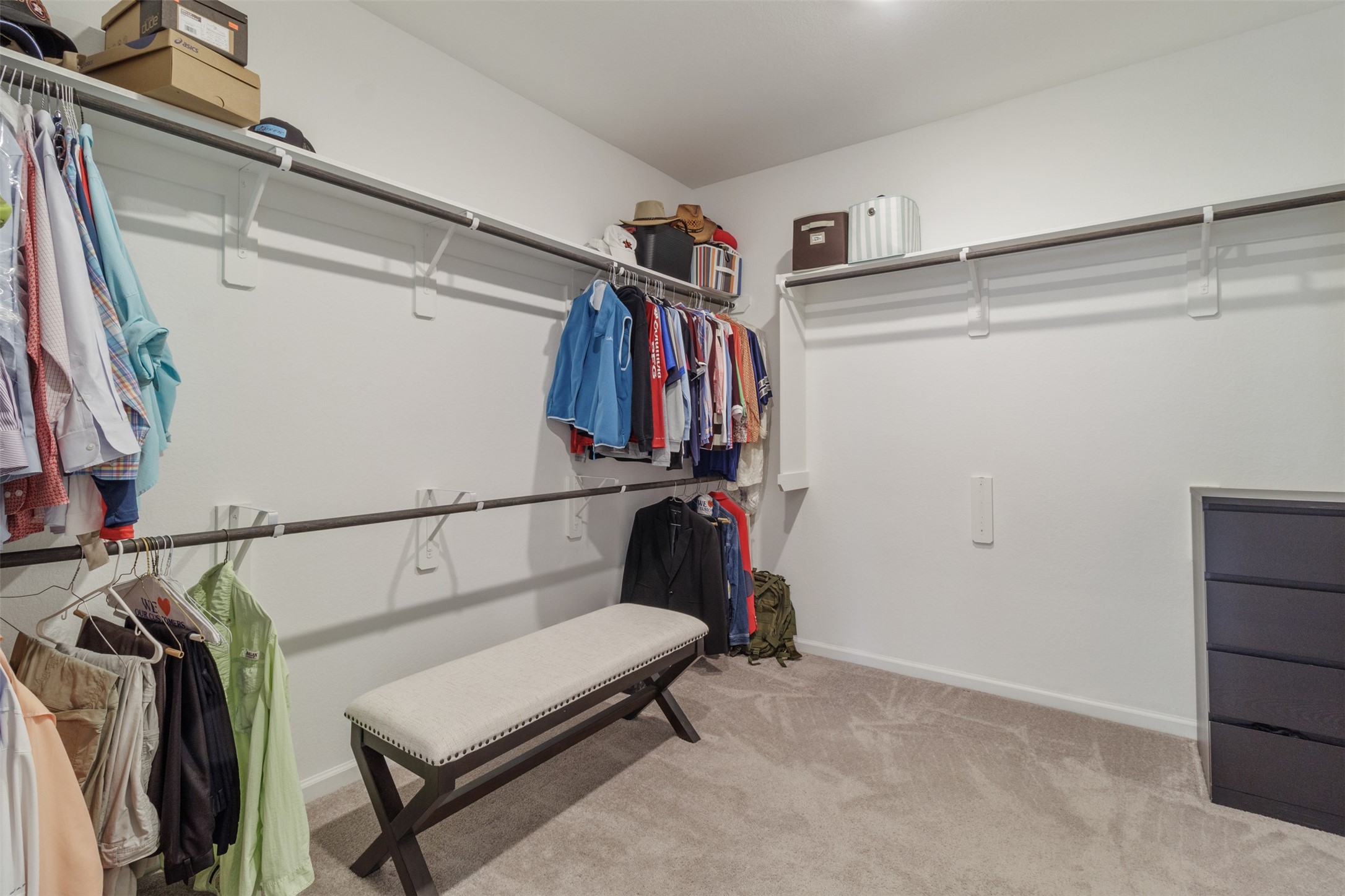 3623 Rock Ledge Drive Rosenberg, TX 77469 - Photo 28 of 31 a view of walk in closet with clothes and shoes