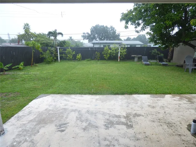 a view of backyard with green space