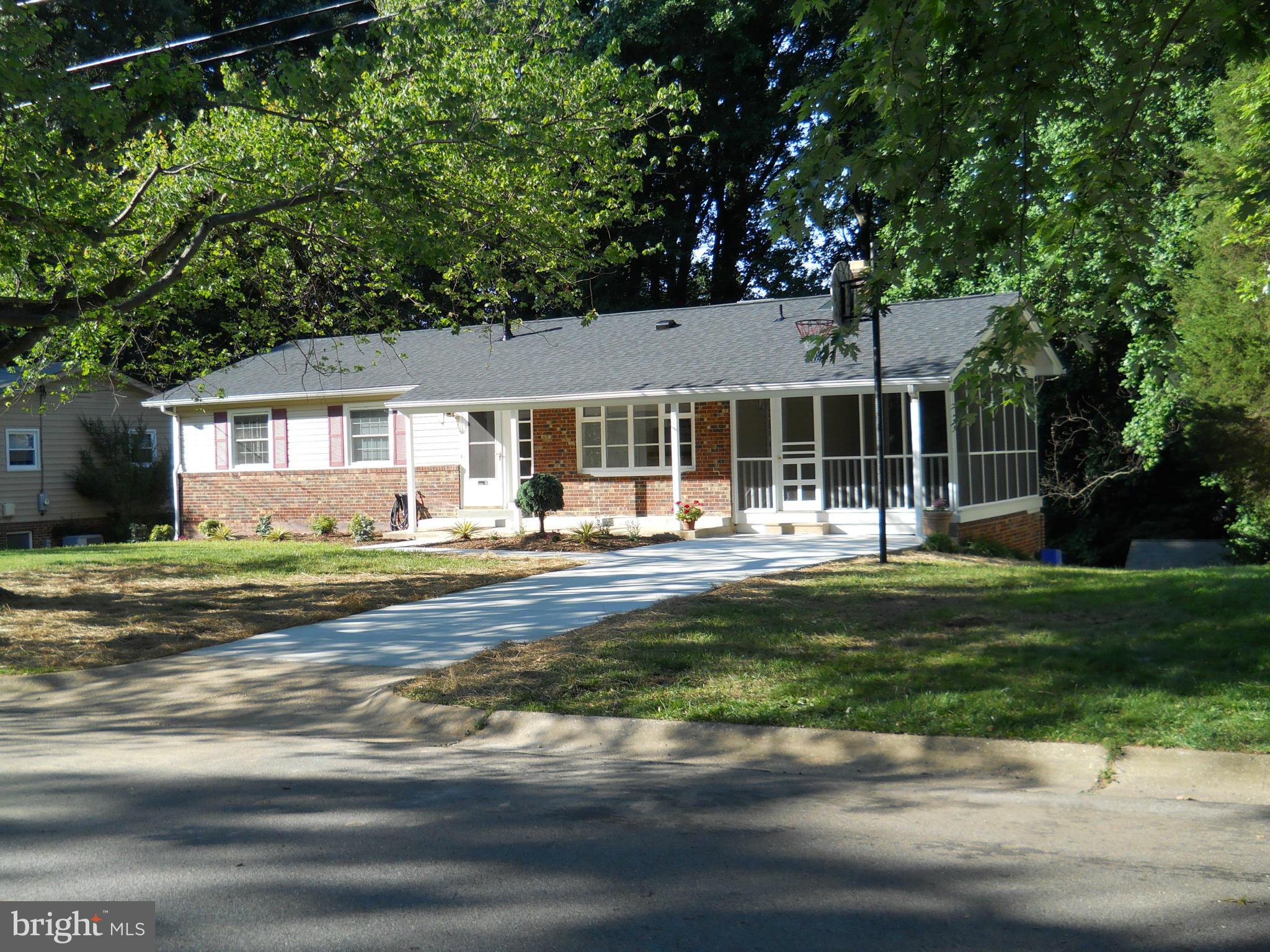 13145 Clifton Road Silver Spring, MD 20904 - Photo 2 of 30 a front view of a house with a garden