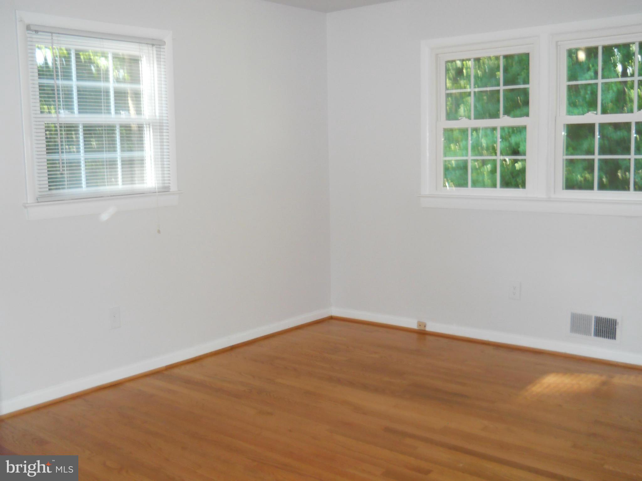 13145 Clifton Road Silver Spring, MD 20904 - Photo 16 of 30 an empty room with a window