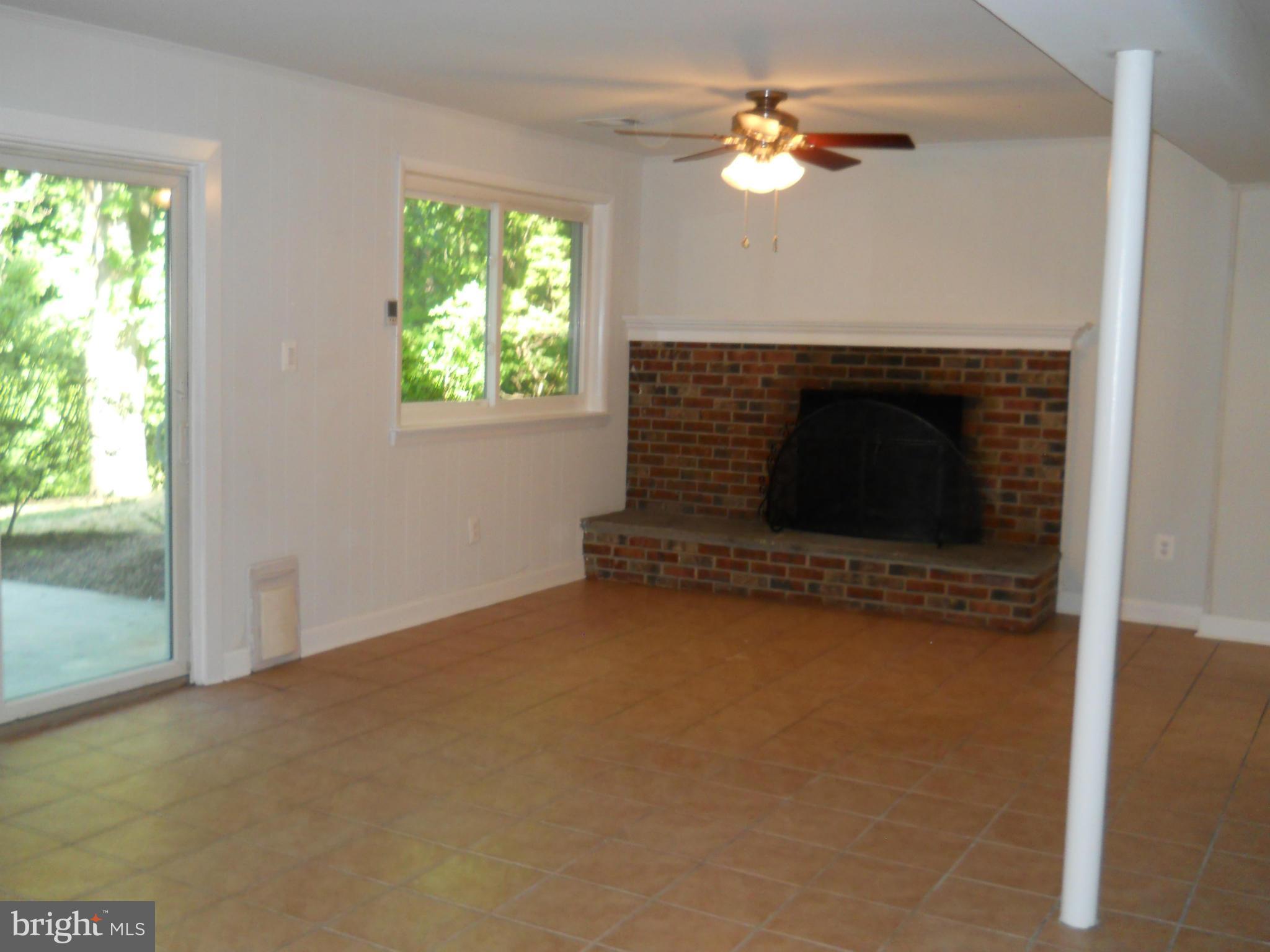 13145 Clifton Road Silver Spring, MD 20904 - Photo 21 of 30 a view of fireplace with window
