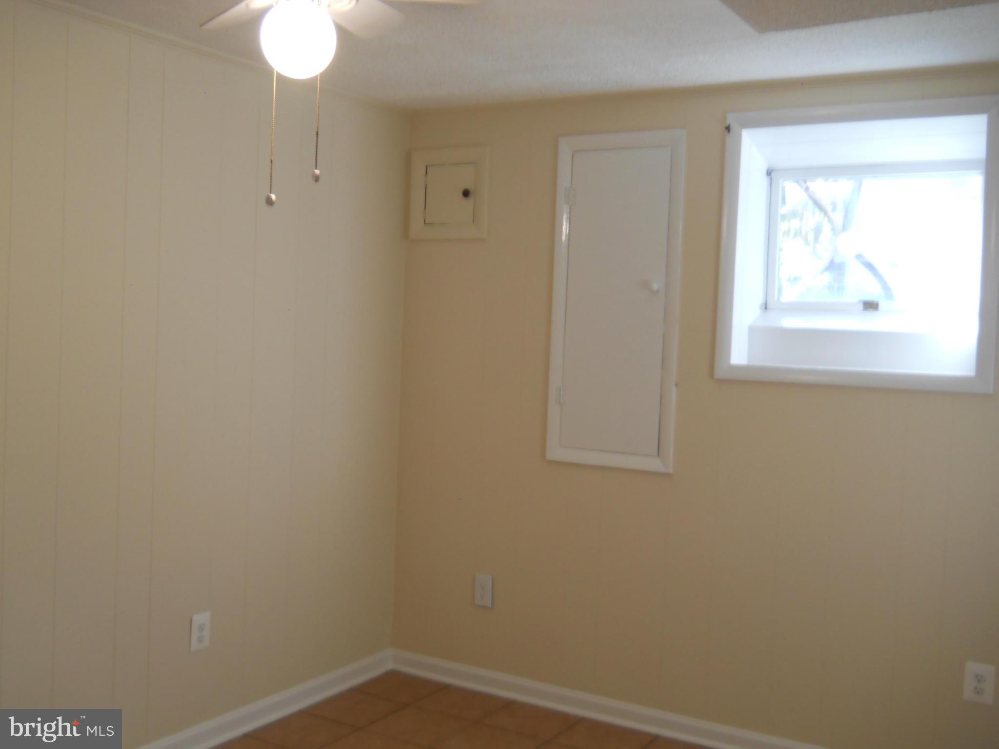 13145 Clifton Road Silver Spring, MD 20904 - Photo 23 of 30 an empty room with a window