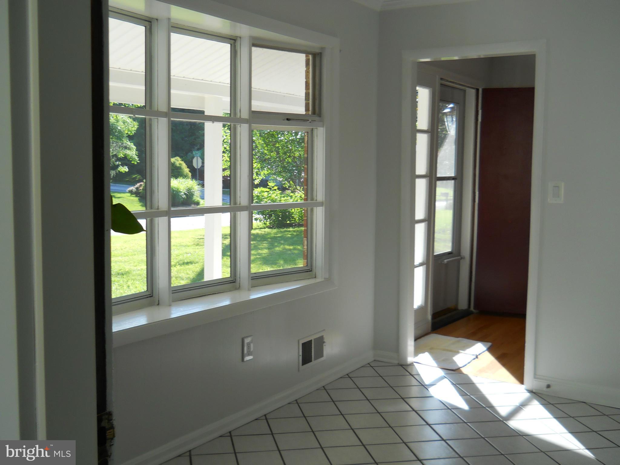 13145 Clifton Road Silver Spring, MD 20904 - Photo 10 of 30 an empty room with windows