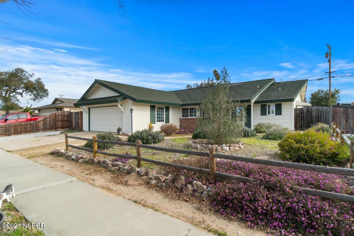 4085 Constellation Road Lompoc, CA 93436 - Photo 1 of 24 a front view of a house with garden