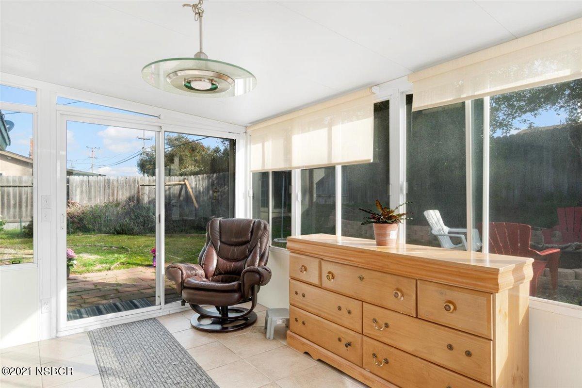 4085 Constellation Road Lompoc, CA 93436 - Photo 14 of 24 a room with a bed and large windows