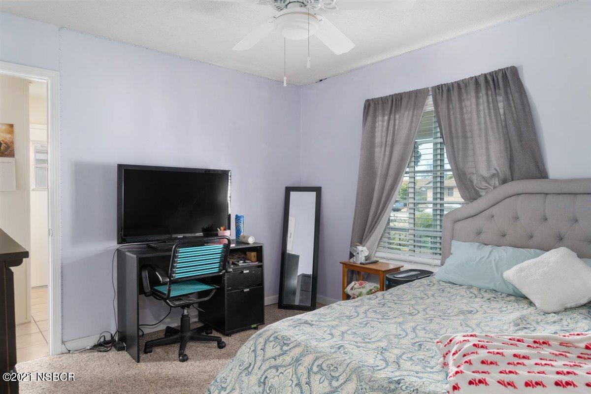 4085 Constellation Road Lompoc, CA 93436 - Photo 16 of 24 a bedroom with a bed and a flat screen tv