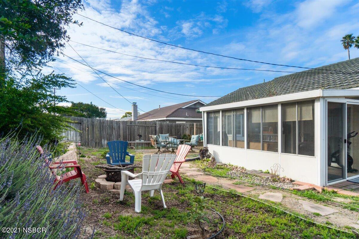 4085 Constellation Road Lompoc, CA 93436 - Photo 23 of 24 a view of a house with backyard sitting area and garden