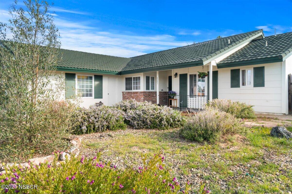 4085 Constellation Road Lompoc, CA 93436 - Photo 3 of 24 a front view of a house with garden