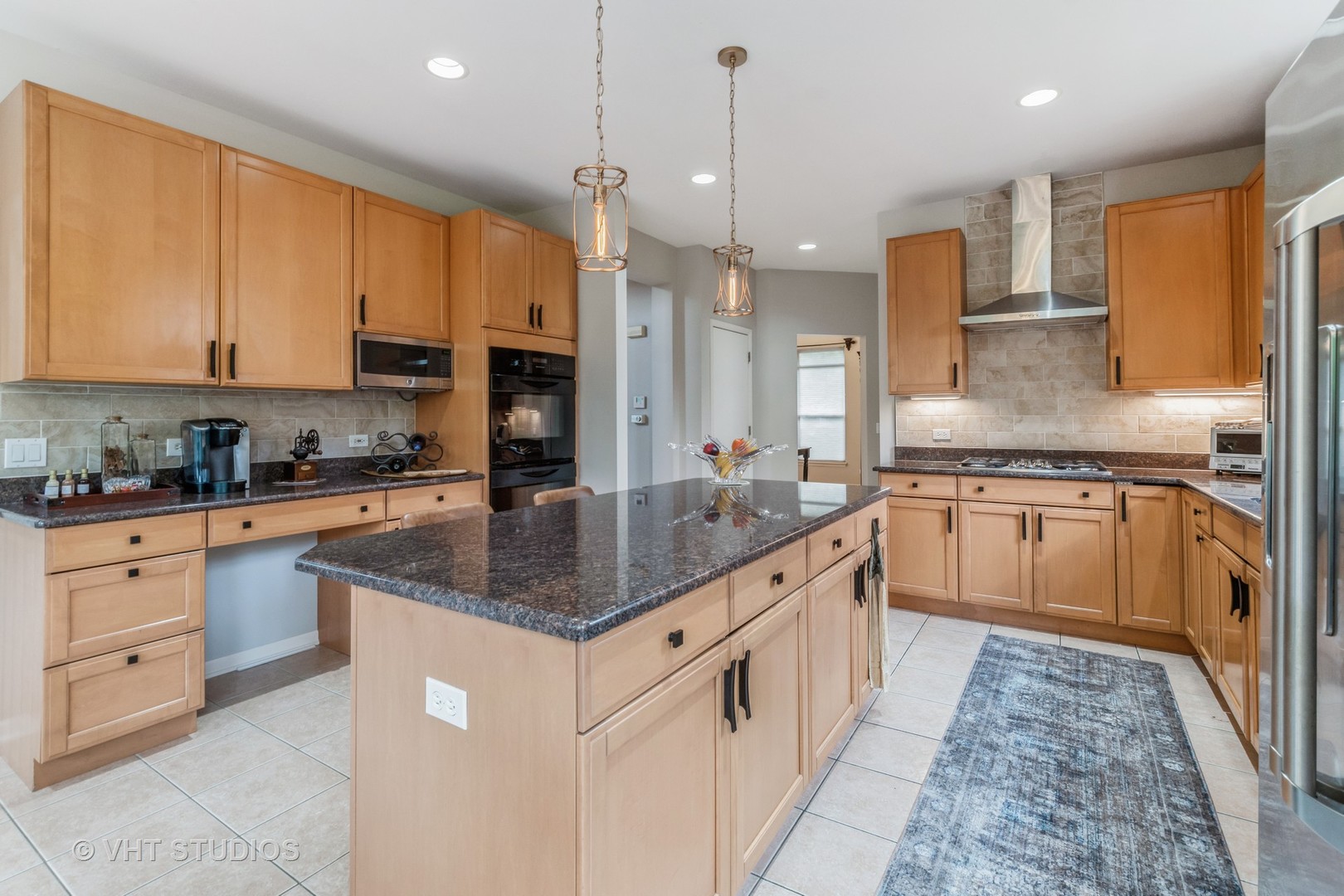 190 Janes Loop Highwood, IL 60040 - Photo 10 of 34 a kitchen with stainless steel appliances granite countertop a sink a stove and a refrigerator