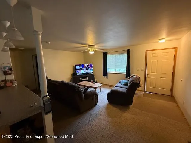 a living room with furniture and a flat screen tv