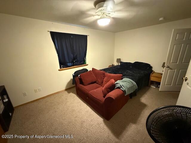 1333 East Victory Way Craig, CO 81625 - Photo 4 of 8 a living room with a couch and a painting on the wall